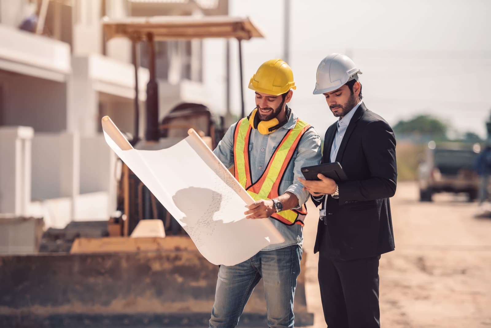 Superintendent and client reviewing drawings on site
