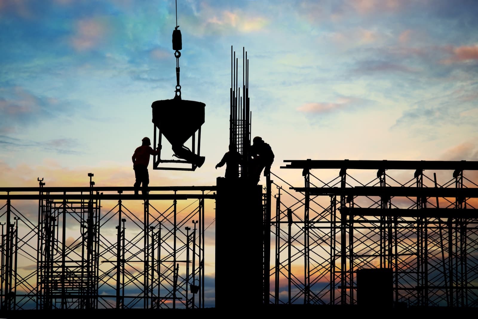 Concrete pour in progress at dusk
