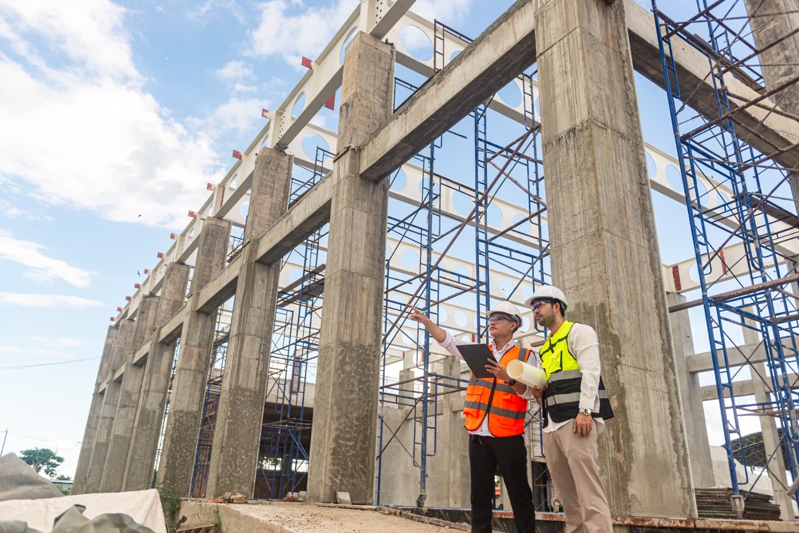 Crew reviewing drawings inside a concrete structure